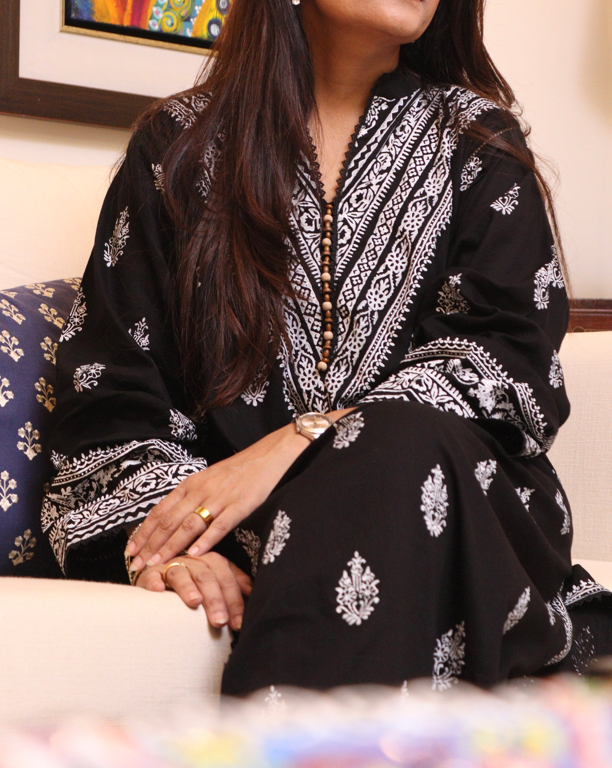 Naqsh black and white block-printed kurta with patterned neckline, seated front view